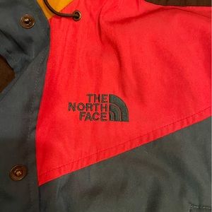 Unique vintage North face wind/rain jacket. Magenta, brown/gold, teal. 12/large